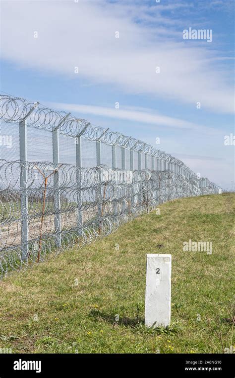 Border fence between Rastina (Serbia) & Bacsszentgyorgy (Hungary) with ...