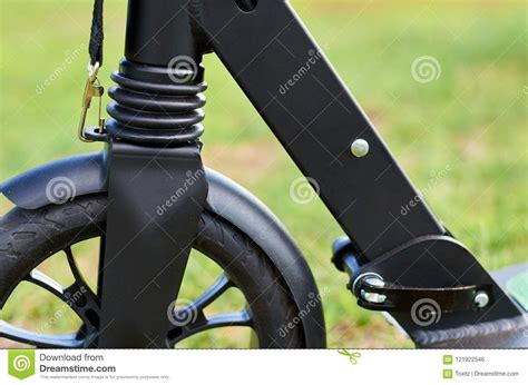 Black Folding Kick Scooter, Close Up Parts, Front Wheel Stock Photo ...