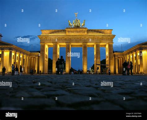 night view of Brandenburg Gate, historic buildings in Berlin Stock Photo - Alamy