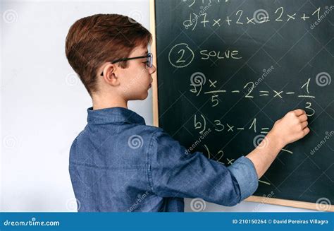 Boy Solving Math Exercises on Blackboard Stock Photo - Image of standing, smart: 210150264