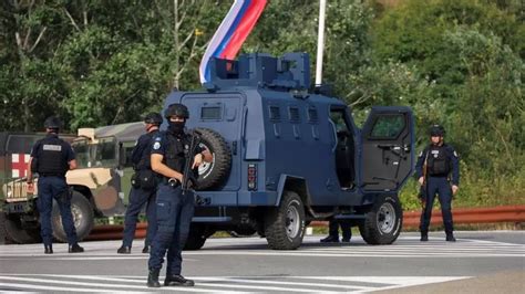 Kosovo police surround 30 gunmen in monastery after officer shot