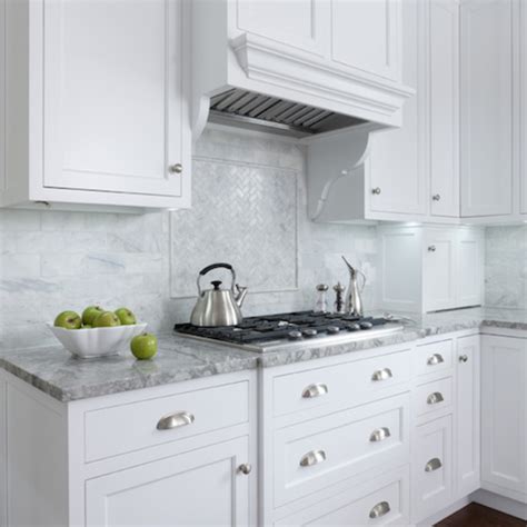 Super White Quartzite ennobles white kitchens beautifully! White shaker ...