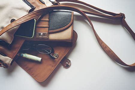 Royalty-Free photo: Four assorted-color leather handbags | PickPik