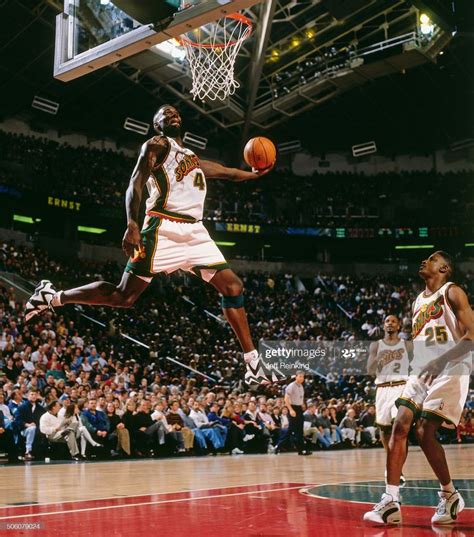 Shawn Kemp of the Seattle Supersonics dunks during a game circa 1996 ...