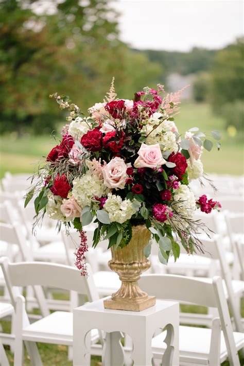 Gold Pedestal Ceremony Arrangement with Pink Roses and Red Ranunculus