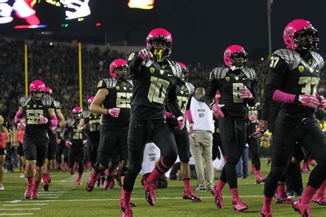 the football team is running onto the field