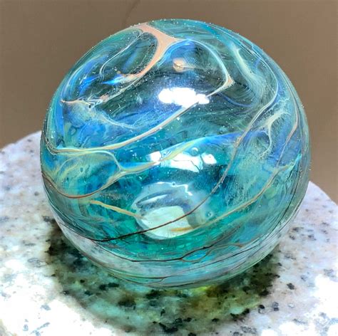 Delicate blown glass hollow sphere mounted on stone Wall Spheres, Decorating Coffee Tables ...