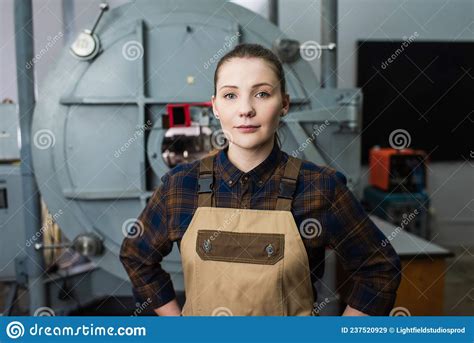 Brunette Welder in Overalls Looking at Stock Image - Image of machinery ...