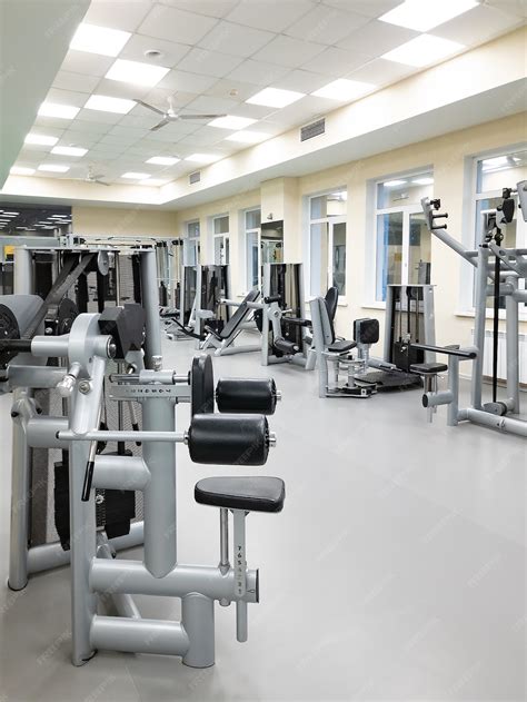 Premium Photo | An empty gym with exercise equipment.