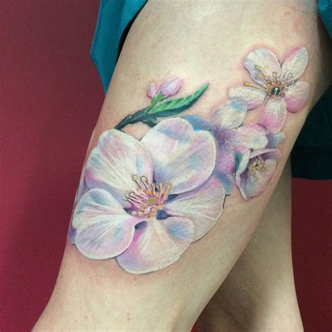 Lovely white and pastel flower tattoo by Nadine from Metamorphosis | White flower tattoos ...