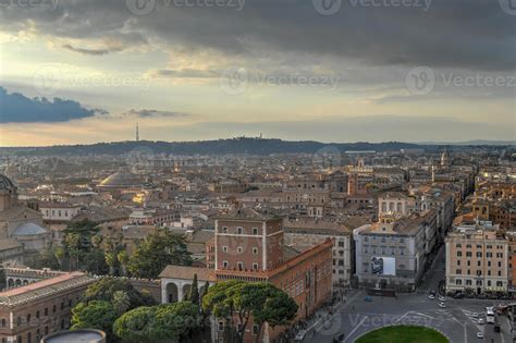 Aerial view of the skyline of Rome, Italy as sunset approaches ...