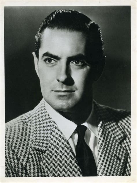 an old black and white photo of a man in a suit