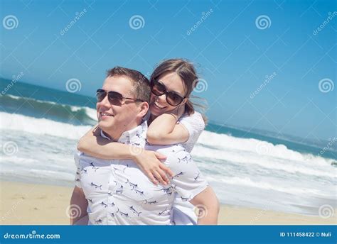 Young Romantic Couple Hugging on the Beach Stock Photo - Image of love, dating: 111458422