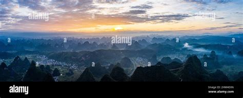 South of guilin karst landform morning mist sunrise scene Stock Photo ...