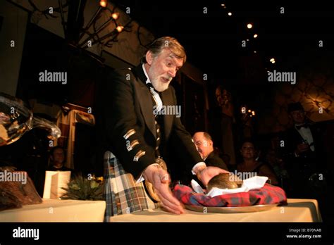 Addressing the haggis at a traditional Burns Night Supper Stock Photo ...