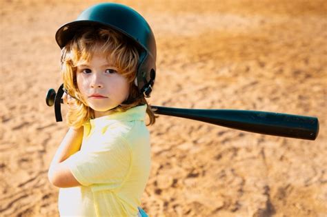 Premium Photo | Child batter about to hit a pitch during a baseball ...