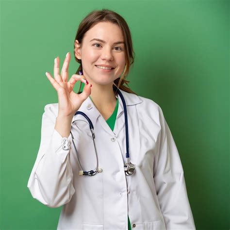 Premium AI Image | A female doctor in a white coat gives a peace sign