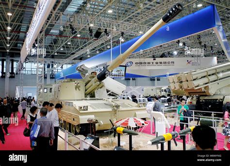 Visitors look at a Chinese-made PLZ52 155mm self-propelled howitzer of ...