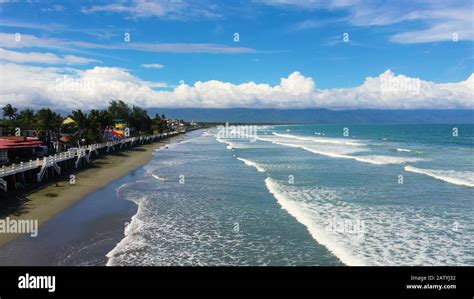 The city of Baler in the Philippines, known as the capital of surfing. Wide beach with big waves ...