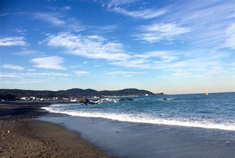 a beach with waves coming in to shore