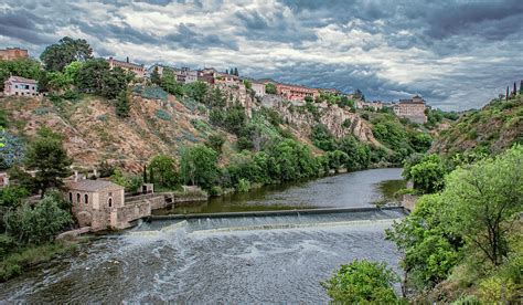 Along the Tagus River in Toledo, Spain Photograph by Marcy Wielfaert - Pixels