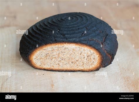 Burnt bread - burnt homemade loaf of bread Stock Photo - Alamy