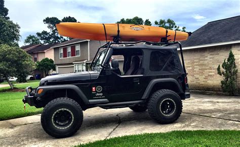 Got my new cargo rack to carry the new kayak on the 04 TJ soft top. The rack is hinged and ...