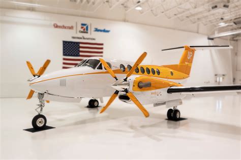 Wheels Up Unveils Orange Plane for Hunger Action Month - Elite Traveler