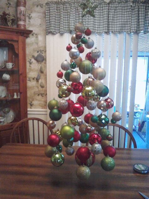 MY FLOATING CHRISTMAS TREE THAT I HUNG EACH BALL FROM MY CEILING FAN WITH FISH LINE AND AN ...