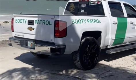 Driver of truck made to look like that of the US border patrol with "Booty Patrol" printed on ...