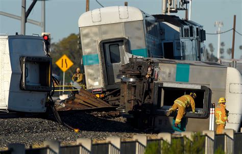 Truck stalls on track before fiery train crash, 28 injured