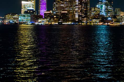 Boston Skyline Nighttime Giclée Print: City Lights Dance on Harbor Waters