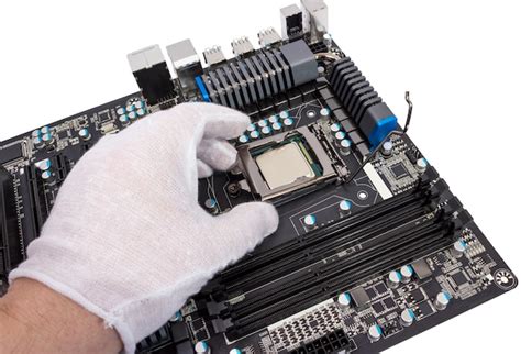 Premium Photo | Installation of modern processor in CPU socket on the ...