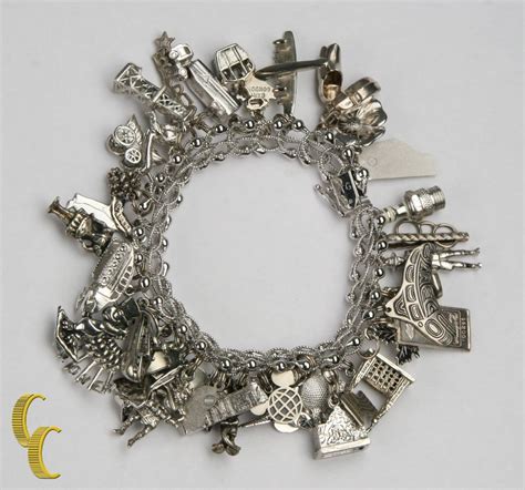 Unique Sterling Silver Charm Bracelet with 35 Charms | Sterling silver charm bracelet, Silver ...