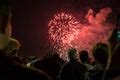 Free image of Crowd of people watching a fireworks display