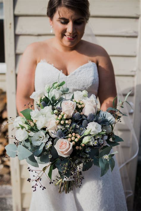 My large but beautiful wedding bouquet. Juliet roses, Sea Holly, Hypercuim Berries, Blue Gum, E ...