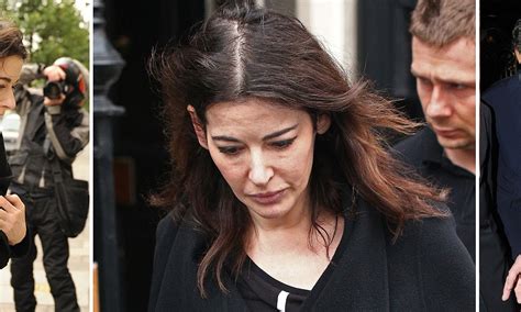 Nigella Lawson emerges from her sister's Mayfair flat as husband Charles Saatchi dines alone