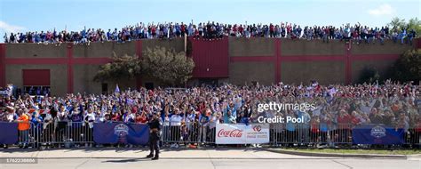 Fans line the parade route and rooftops during the Texas Rangers ...