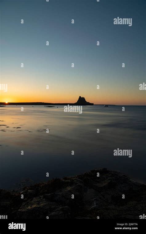 Holy Island (Lindisfarne) Castle sunrise Stock Photo - Alamy