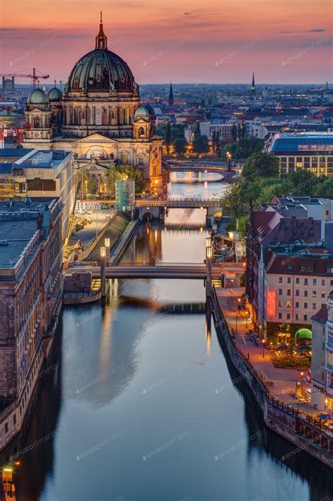 The Spree river in Berlin at sunset photo by elxeneize on Envato Elements | Berlin germany ...