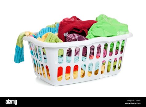 White plastic laundry basket full of dirty clothes Stock Photo - Alamy