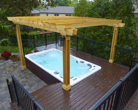 Hydropool Self Cleaning swim spa installed into a deck with gazebo | Hot tub pergola, Swim spa ...