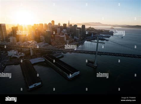 Aerial view of Bay Bridge by cityscape during sunset Stock Photo - Alamy