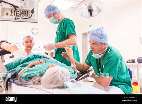 A patient undergoes a coloscopy under hypnosis, Argentan hospital, France Stock Photo - Alamy