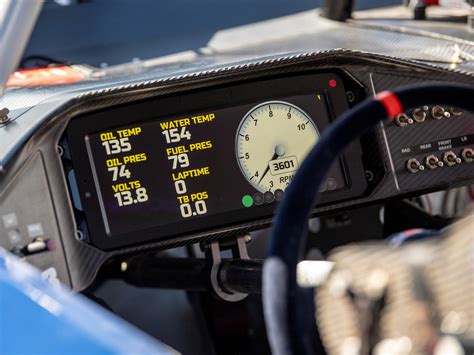 The digital dashboard of a car is lit up during tuning in preparation ...