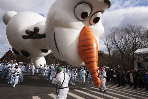 The Latest: Winds don’t stop balloons at NYC parade