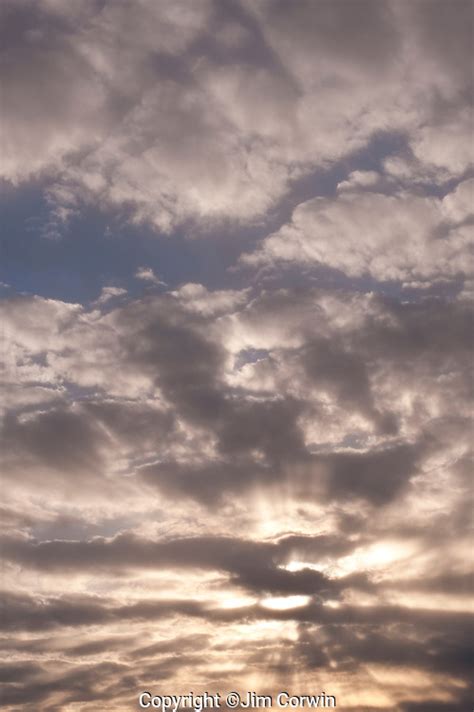 Stratocumulus clouds with sunrays at sunset | Jim Corwin Photographer