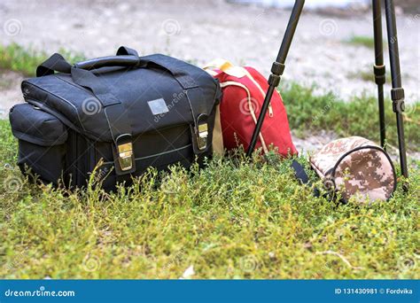 Bag for the Camera, a Tripod and a Red Backpack. Kit for the Photographer for Travel Stock Image ...