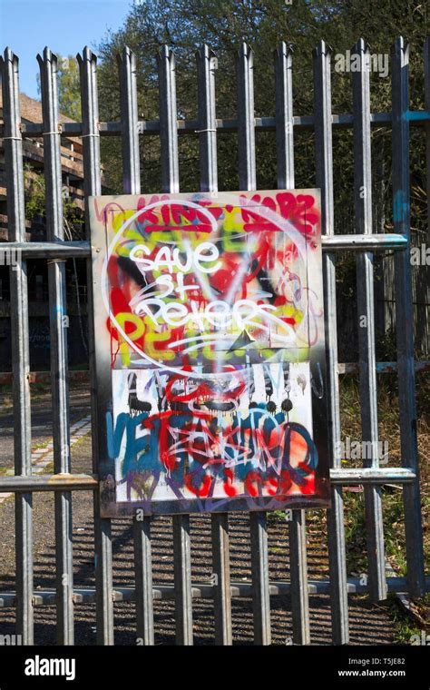 Graffiti on a sign at the gate of the ruined St Peters Seminary, Cardross, Scotland. Save St ...