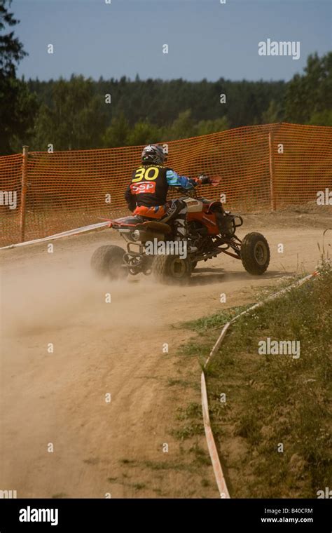 Quad rider during off road race Stock Photo - Alamy